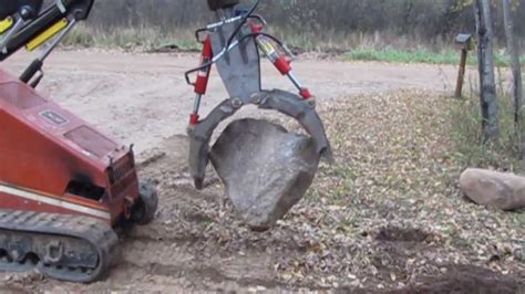 moving 24 inch rocks with a skid steer|best way to move rocks.